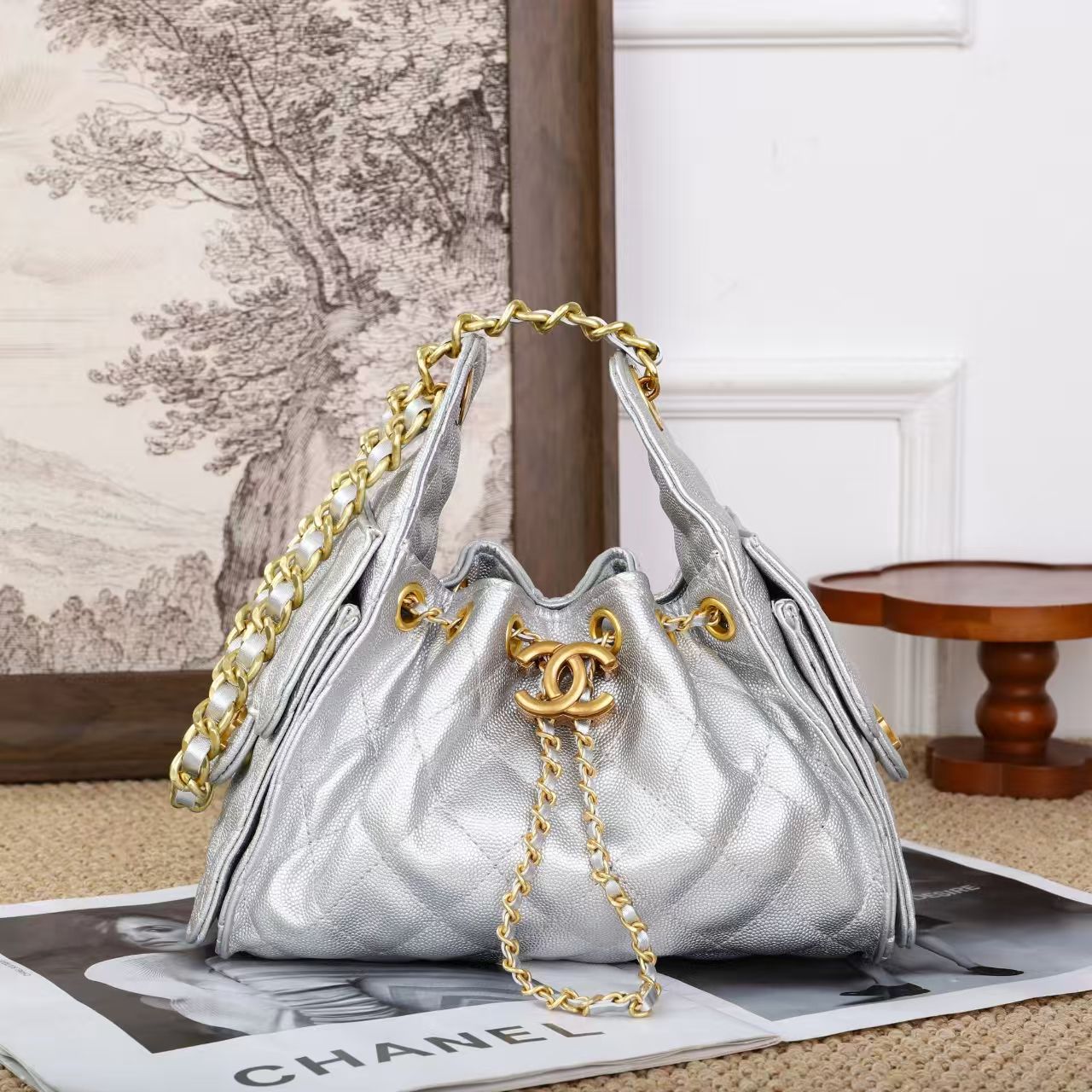 Chanel – Quilted Drawstring Bucket Bag (Metallic Silver with Gold Hardware)