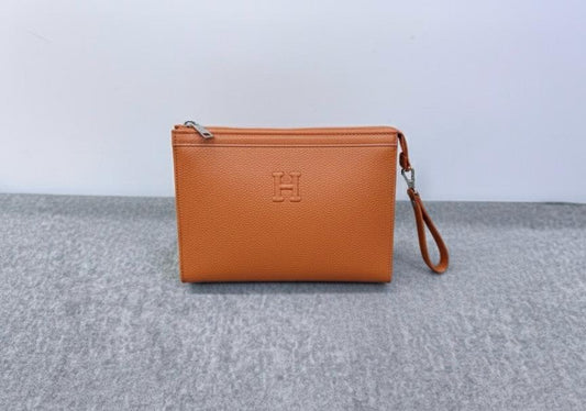 Hermès “H” Embossed Leather Pouch – Classic Orange Edition