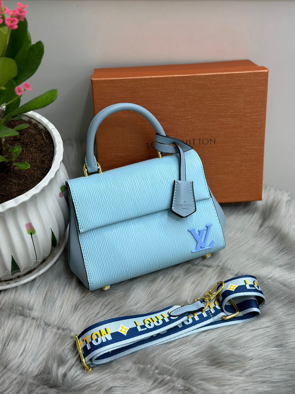 Louis Vuitton – Eden Top Handle Bag (Light Blue)